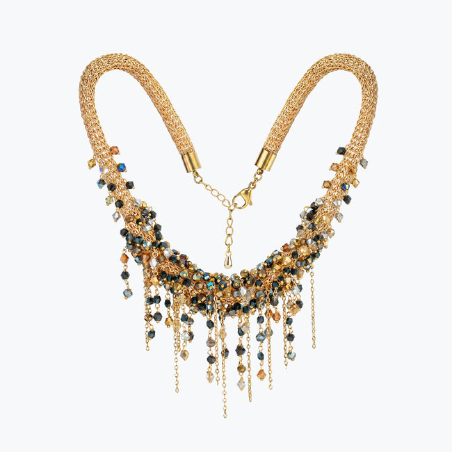 Gold handknitted wire mesh collar necklace decorated with individually hanging metallic, black, and bronze crystals.