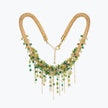 Gold handknitted wire collar necklace adorned with individually hanging premium green and emerald crystals.