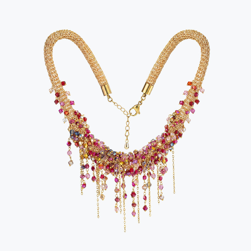 Gold handknitted wire collar necklace featuring individually hanging pink, red, and fuchsia premium crystals.