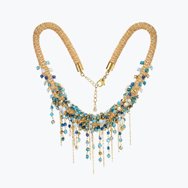 Gold handknitted wire mesh collar necklace with individually hanging blue, teal, and clear premium crystals.