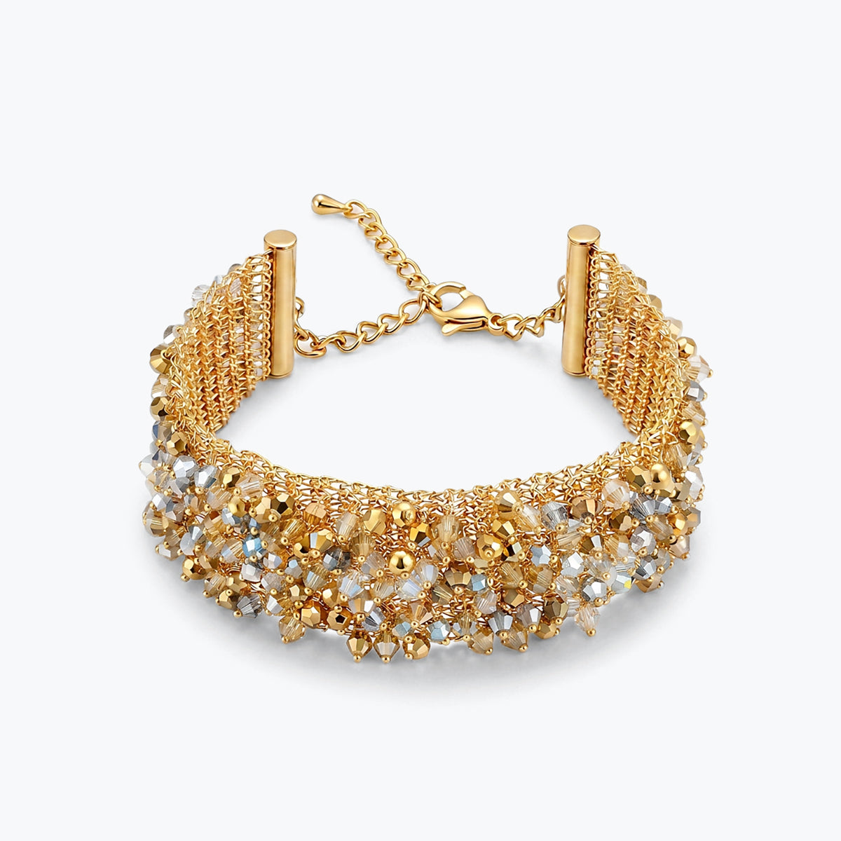 Gold ribbon bracelet with a wavy handknitted wire mesh holding clear and gold reflective crystals.