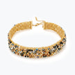 Handknitted wire mesh gold choker with individually hanging crystals in metallic black, bronze, and silver.