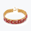 Handknitted gold wire mesh choker necklace featuring reflective premium crystals in red and pink tones.