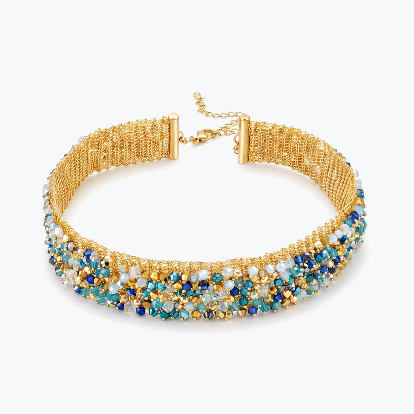 Gold handknitted wire choker necklace featuring premium crystals in vibrant blue, turquoise, and white.